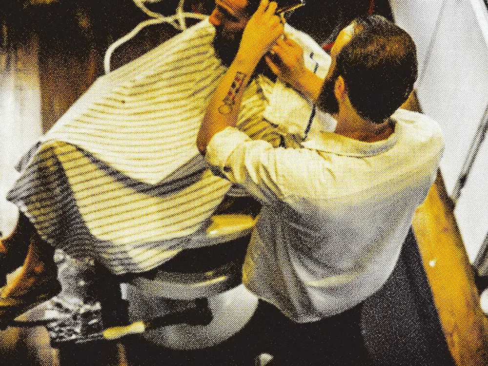 Jeremy Williams cutting a client's hair at Laurel Barber